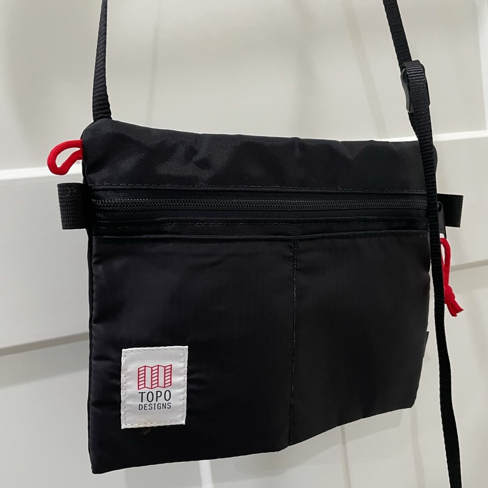 Topo Designs Black Crossbody Bag with Red Accents